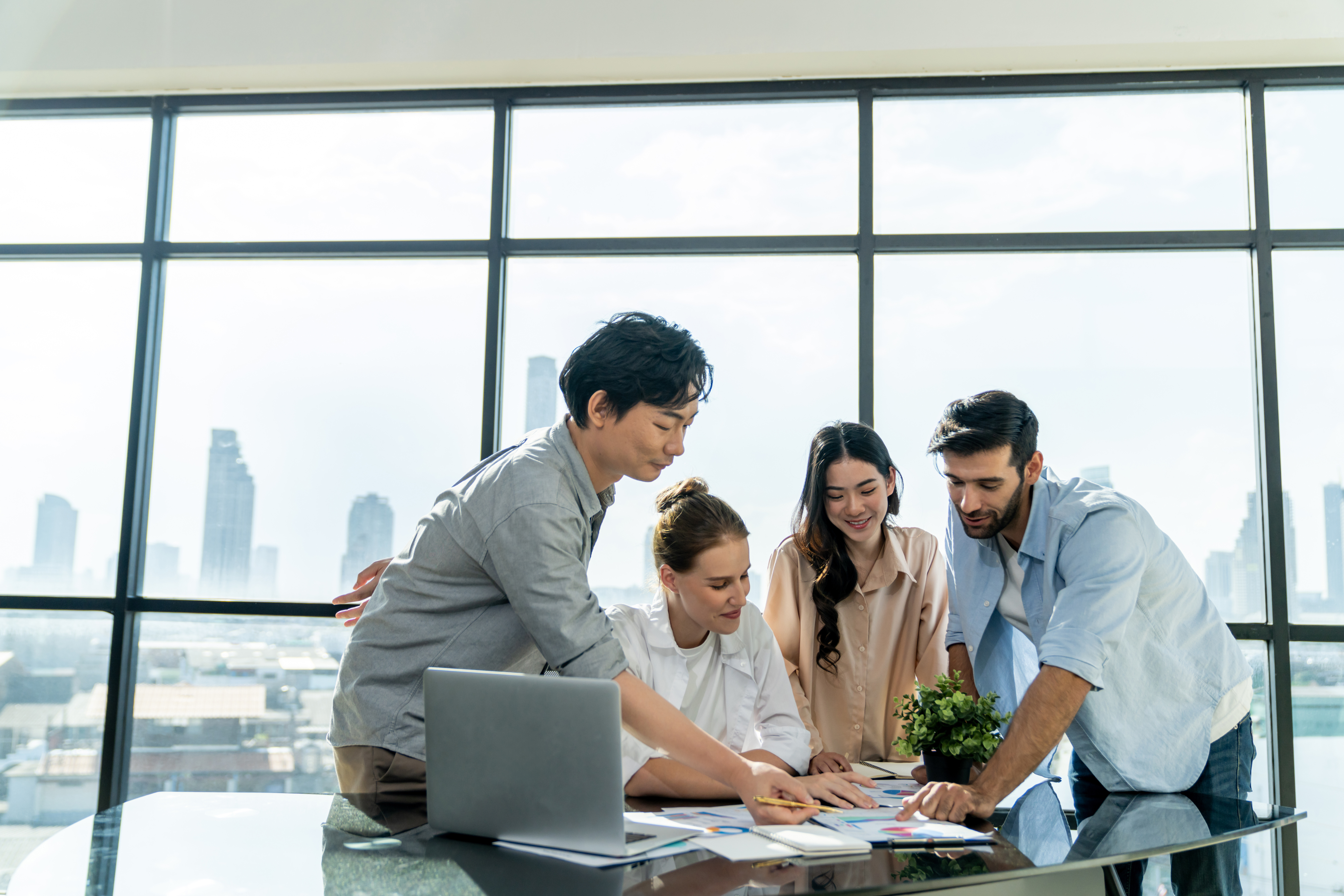 Photo of a study hall with wooden tables and chairs.